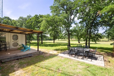 Positioned between the peaceful setting of Amon Carter Lake and on Twisted Oaks Golf Club in Texas - for sale on GolfHomes.com, golf home, golf lot