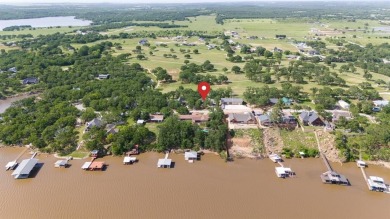 Positioned between the peaceful setting of Amon Carter Lake and on Twisted Oaks Golf Club in Texas - for sale on GolfHomes.com, golf home, golf lot