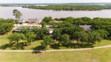 Positioned between the peaceful setting of Amon Carter Lake and on Twisted Oaks Golf Club in Texas - for sale on GolfHomes.com, golf home, golf lot