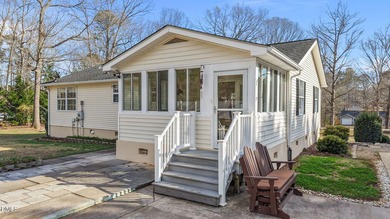 Welcome to lake living in this charming Ranch home located in a on River Golf and Country Club at Lake Royale in North Carolina - for sale on GolfHomes.com, golf home, golf lot