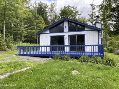 Fall in love with this sweet, simple, and affordable getaway in on The Hideout Golf in Pennsylvania - for sale on GolfHomes.com, golf home, golf lot