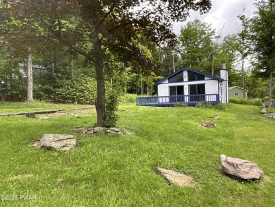 Fall in love with this sweet, simple, and affordable getaway in on The Hideout Golf in Pennsylvania - for sale on GolfHomes.com, golf home, golf lot