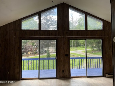 Fall in love with this sweet, simple, and affordable getaway in on The Hideout Golf in Pennsylvania - for sale on GolfHomes.com, golf home, golf lot