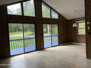 Fall in love with this sweet, simple, and affordable getaway in on The Hideout Golf in Pennsylvania - for sale on GolfHomes.com, golf home, golf lot