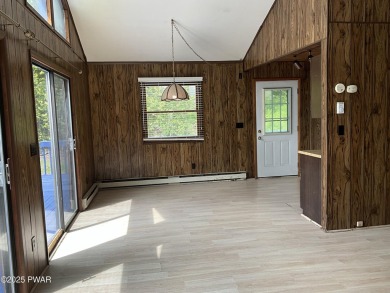 Fall in love with this sweet, simple, and affordable getaway in on The Hideout Golf in Pennsylvania - for sale on GolfHomes.com, golf home, golf lot