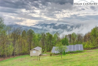 Sunset views, solar power, and space for everyone--this on Mountain Aire Golf Course in North Carolina - for sale on GolfHomes.com, golf home, golf lot