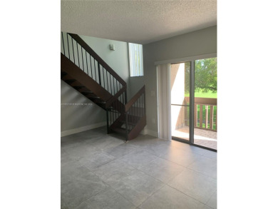 Welcoming patio to your private entrance. Close to everything; on Fontainebleau Golf Course in Florida - for sale on GolfHomes.com, golf home, golf lot