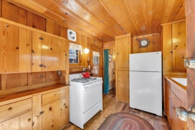 Welcome to Haleiwa! This fully furnished 1928 original Tahoe on Old Brockway Golf Club in California - for sale on GolfHomes.com, golf home, golf lot