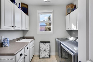 A stunning house built by Kent Homes with too many upgrades to on Cape Fear National At Brunswick Forest in North Carolina - for sale on GolfHomes.com, golf home, golf lot