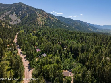 Tucked into the trees on a quiet street in Star Valley Ranch on Star Valley RV Golf Course in Wyoming - for sale on GolfHomes.com, golf home, golf lot