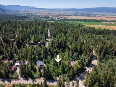 Tucked into the trees on a quiet street in Star Valley Ranch on Star Valley RV Golf Course in Wyoming - for sale on GolfHomes.com, golf home, golf lot