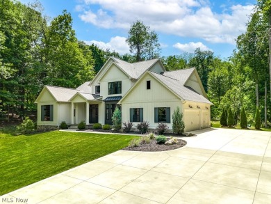 Nestled on over 1.5 wooded acres in Orange School District, this on The Country Club in Ohio - for sale on GolfHomes.com, golf home, golf lot