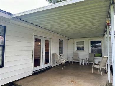 FRESH NEW LOOK! BRAND NEW VINYL PLANK FLOORING THROUGHOUT AND A on Frasch Park Golf Course in Louisiana - for sale on GolfHomes.com, golf home, golf lot