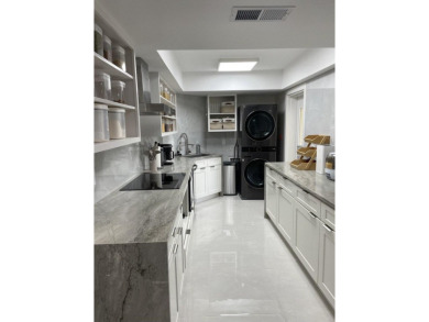 This stunning residence boasts two generously sized master on The President Country Club in Florida - for sale on GolfHomes.com, golf home, golf lot