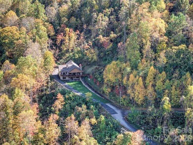 Built in 2025 this one of kind 5.7-acre property is only minutes on Waynesville Country Club Inn in North Carolina - for sale on GolfHomes.com, golf home, golf lot