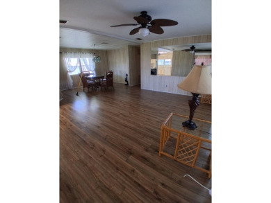 This lovely 1982 mobile home comes unfurnished and is poised and on Royal Wood Golf and Country Club in Florida - for sale on GolfHomes.com, golf home, golf lot