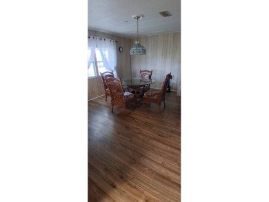 This lovely 1982 mobile home comes unfurnished and is poised and on Royal Wood Golf and Country Club in Florida - for sale on GolfHomes.com, golf home, golf lot