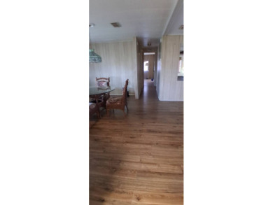 This lovely 1982 mobile home comes unfurnished and is poised and on Royal Wood Golf and Country Club in Florida - for sale on GolfHomes.com, golf home, golf lot