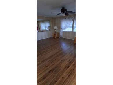 This lovely 1982 mobile home comes unfurnished and is poised and on Royal Wood Golf and Country Club in Florida - for sale on GolfHomes.com, golf home, golf lot