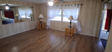 This lovely 1982 mobile home comes unfurnished and is poised and on Royal Wood Golf and Country Club in Florida - for sale on GolfHomes.com, golf home, golf lot