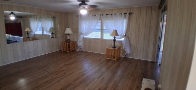 This lovely 1982 mobile home comes unfurnished and is poised and on Royal Wood Golf and Country Club in Florida - for sale on GolfHomes.com, golf home, golf lot