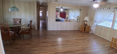 This lovely 1982 mobile home comes unfurnished and is poised and on Royal Wood Golf and Country Club in Florida - for sale on GolfHomes.com, golf home, golf lot