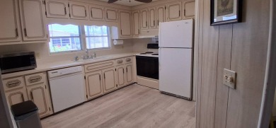 This lovely 1982 mobile home comes unfurnished and is poised and on Royal Wood Golf and Country Club in Florida - for sale on GolfHomes.com, golf home, golf lot