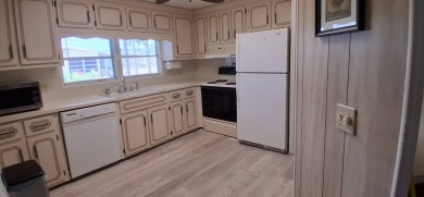 This lovely 1982 mobile home comes unfurnished and is poised and on Royal Wood Golf and Country Club in Florida - for sale on GolfHomes.com, golf home, golf lot