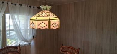 This lovely 1982 mobile home comes unfurnished and is poised and on Royal Wood Golf and Country Club in Florida - for sale on GolfHomes.com, golf home, golf lot
