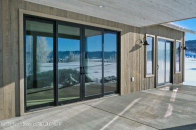 This stunning property features 4 bdrms, 4.5 bathrooms, and an on Teton Reserve in Idaho - for sale on GolfHomes.com, golf home, golf lot