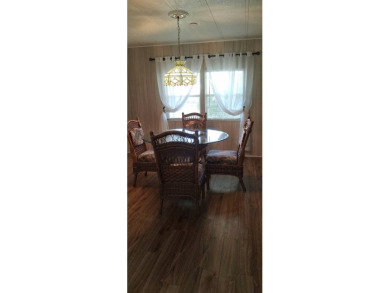This lovely 1982 mobile home comes unfurnished and is poised and on Royal Wood Golf and Country Club in Florida - for sale on GolfHomes.com, golf home, golf lot