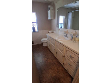 This lovely 1982 mobile home comes unfurnished and is poised and on Royal Wood Golf and Country Club in Florida - for sale on GolfHomes.com, golf home, golf lot