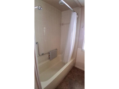 This lovely 1982 mobile home comes unfurnished and is poised and on Royal Wood Golf and Country Club in Florida - for sale on GolfHomes.com, golf home, golf lot
