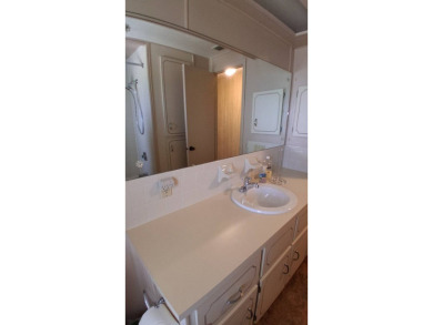 This lovely 1982 mobile home comes unfurnished and is poised and on Royal Wood Golf and Country Club in Florida - for sale on GolfHomes.com, golf home, golf lot