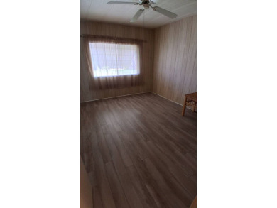 This lovely 1982 mobile home comes unfurnished and is poised and on Royal Wood Golf and Country Club in Florida - for sale on GolfHomes.com, golf home, golf lot