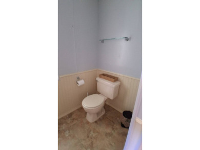 This lovely 1982 mobile home comes unfurnished and is poised and on Royal Wood Golf and Country Club in Florida - for sale on GolfHomes.com, golf home, golf lot