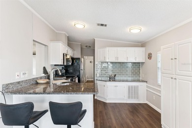 A beautifully updated 2-bedroom, 1-bathroom manufactured home in on Polo Park East in Florida - for sale on GolfHomes.com, golf home, golf lot