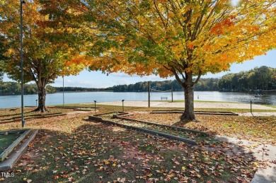 Welcome to 101 Cochise Cove, a 3-bedroom, 3.5-bath home with 3 on River Golf and County Club at Lake Royale in North Carolina - for sale on GolfHomes.com, golf home, golf lot