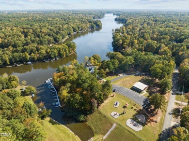 Welcome to 101 Cochise Cove, a 3-bedroom, 3.5-bath home with 3 on River Golf and County Club at Lake Royale in North Carolina - for sale on GolfHomes.com, golf home, golf lot