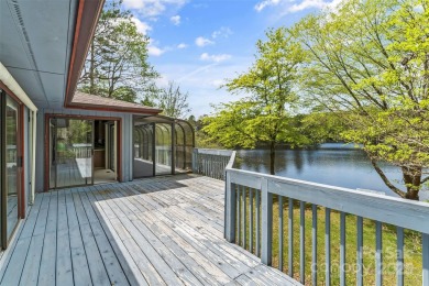 LAKEFRONT LIVING AS IT'S FINEST! Nestled in serene natural on Connestee Falls Golf Club in North Carolina - for sale on GolfHomes.com, golf home, golf lot