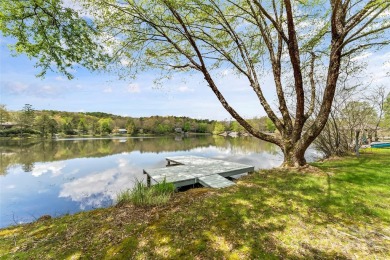 LAKEFRONT LIVING AS IT'S FINEST! Nestled in serene natural on Connestee Falls Golf Club in North Carolina - for sale on GolfHomes.com, golf home, golf lot