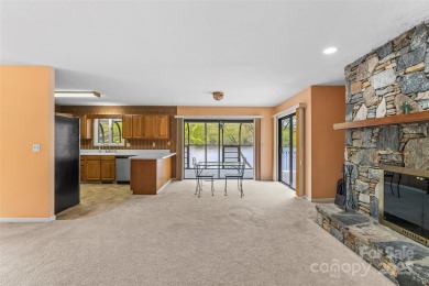 LAKEFRONT LIVING AS IT'S FINEST! Nestled in serene natural on Connestee Falls Golf Club in North Carolina - for sale on GolfHomes.com, golf home, golf lot
