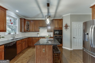 Welcome to this spacious and well-maintained 5-bedroom, 3-bath on Hampton Golf Village in Georgia - for sale on GolfHomes.com, golf home, golf lot