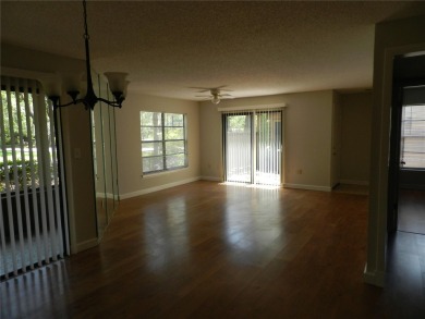 Freshly painted 2 bedroom, 2 bath ground floor end unit with1 on Innisbrook Resort and Golf Club in Florida - for sale on GolfHomes.com, golf home, golf lot