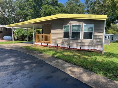 This beautifully remodeled 1,584 square foot, two-bedroom on Palm Hill Golf Club in Florida - for sale on GolfHomes.com, golf home, golf lot