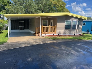 This beautifully remodeled 1,584 square foot, two-bedroom on Palm Hill Golf Club in Florida - for sale on GolfHomes.com, golf home, golf lot