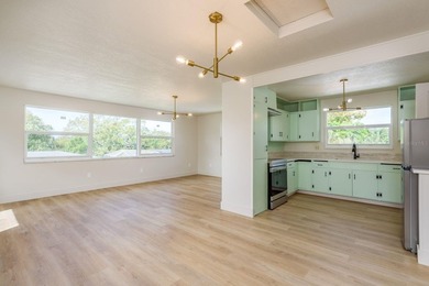 Fully reimagined Fairway Estates home offering over 3,300 sq ft on The Dunedin Country Club in Florida - for sale on GolfHomes.com, golf home, golf lot