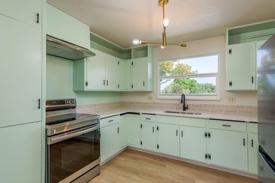 Fully reimagined Fairway Estates home offering over 3,300 sq ft on The Dunedin Country Club in Florida - for sale on GolfHomes.com, golf home, golf lot