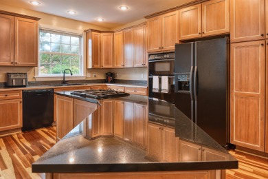 This Stately, all brick colonial is situated on over 1/2 acre on Pete Dye River Course of Virginia Tech in Virginia - for sale on GolfHomes.com, golf home, golf lot