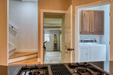This Stately, all brick colonial is situated on over 1/2 acre on Pete Dye River Course of Virginia Tech in Virginia - for sale on GolfHomes.com, golf home, golf lot